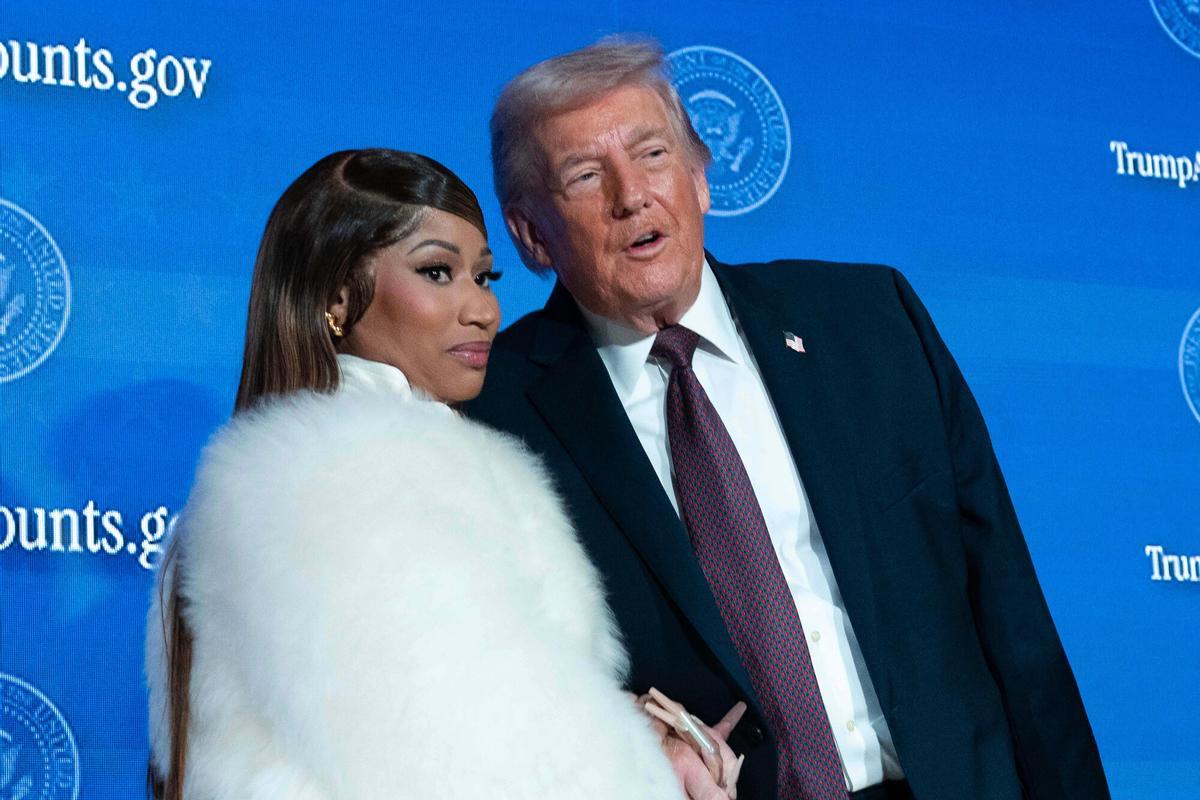 President Donald Trump talks with Nicki Minaj during the launch of a program known as Trump Accounts at Carnegie Mellon Auditorium, Wednesday, Jan. 28, 2026, in Washington. (AP Photo/Jose Luis Magana). EDITORIAL USE ONLY/ONLY ITALY AND SPAIN