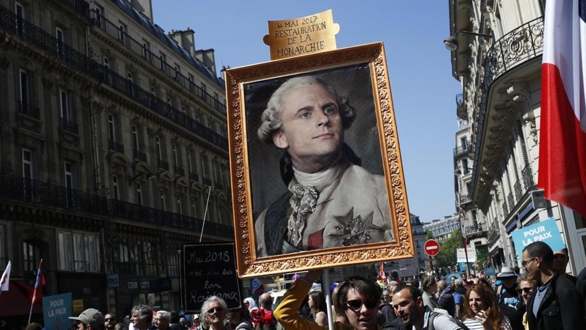 zentauroepp43188141 a protester carries a picture of french president macron dep180505182134