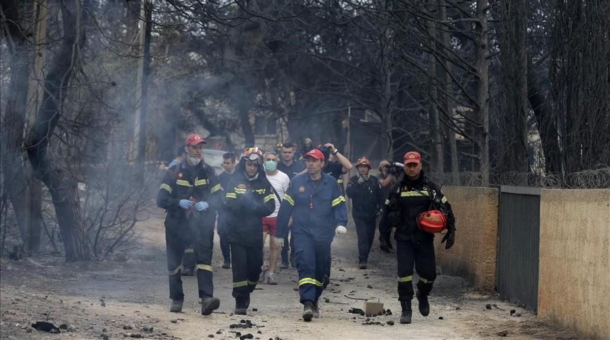 zentauroepp44429553 firefighters inspect a burned area in mati  east of athens  180725171911