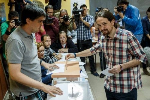 Podemos (We Can) leader Iglesias poses while casting his vote at a polling station during regional and municipal elections in Madrid