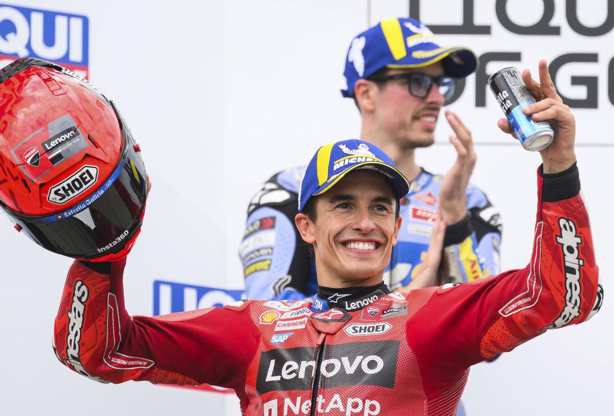 Winner Marc Marquez, front, from Spain from the Ducati Lenovo Team celebrates on the podium ahead of second-placed Alex Marquez from Spain from the Gresini Racing MotoGP Team following the MotoGP race, German Grand Prix, at the Sachsenring circuit, in Hohenstein-Ernstthal, Germany, Sunday July 13, 2025. (Robert Michael/dpa via AP). GERMANY OUT; MANDATORY CREDIT