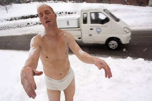 A statue by Tony Matelli titled "Sleepwalker" stands in the snow on the campus of Wellesley College in Wellesley, Massachusetts