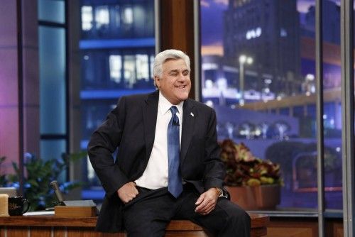 Jay Leno sits on his desk on his final night hosting "The Tonight Show with Jay Leno" in Burbank, California