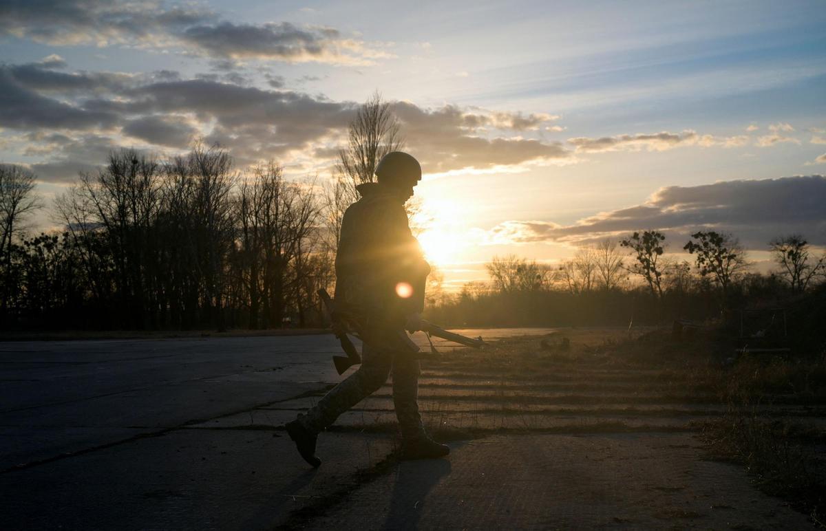 A Ukrainian serviceman takes position at the military airbase Vasylkiv in the Kyiv region