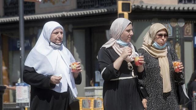 Turistas de Oriente Próximo, el pasado verano, en la Boqueria.