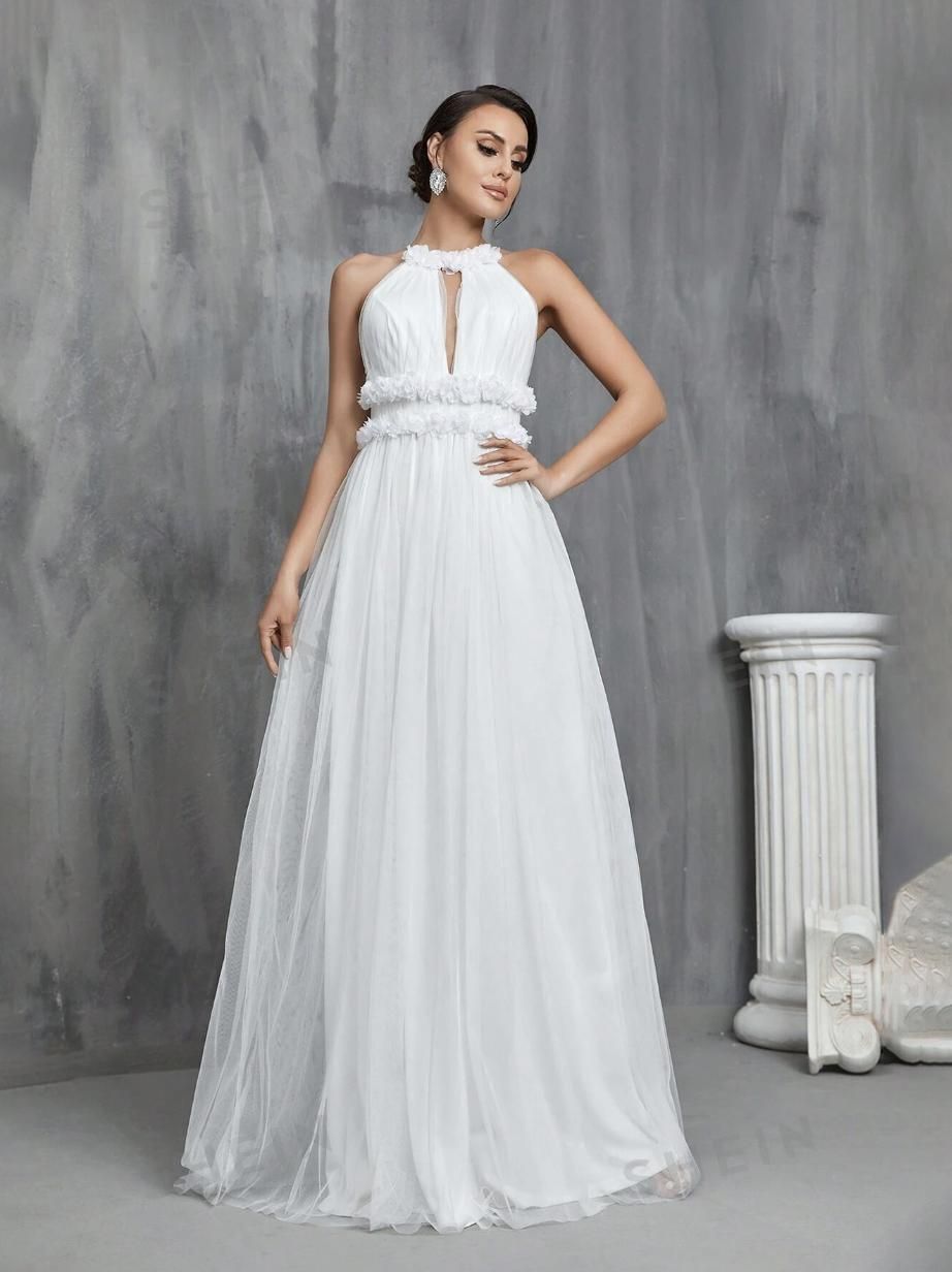 Vestido de novia con cuello halter y espalda abierta