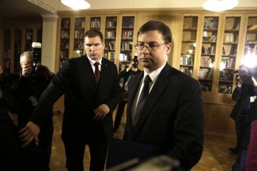 Latvia's Prime Minister Valdis Dombrovskis leaves a news conference in Riga