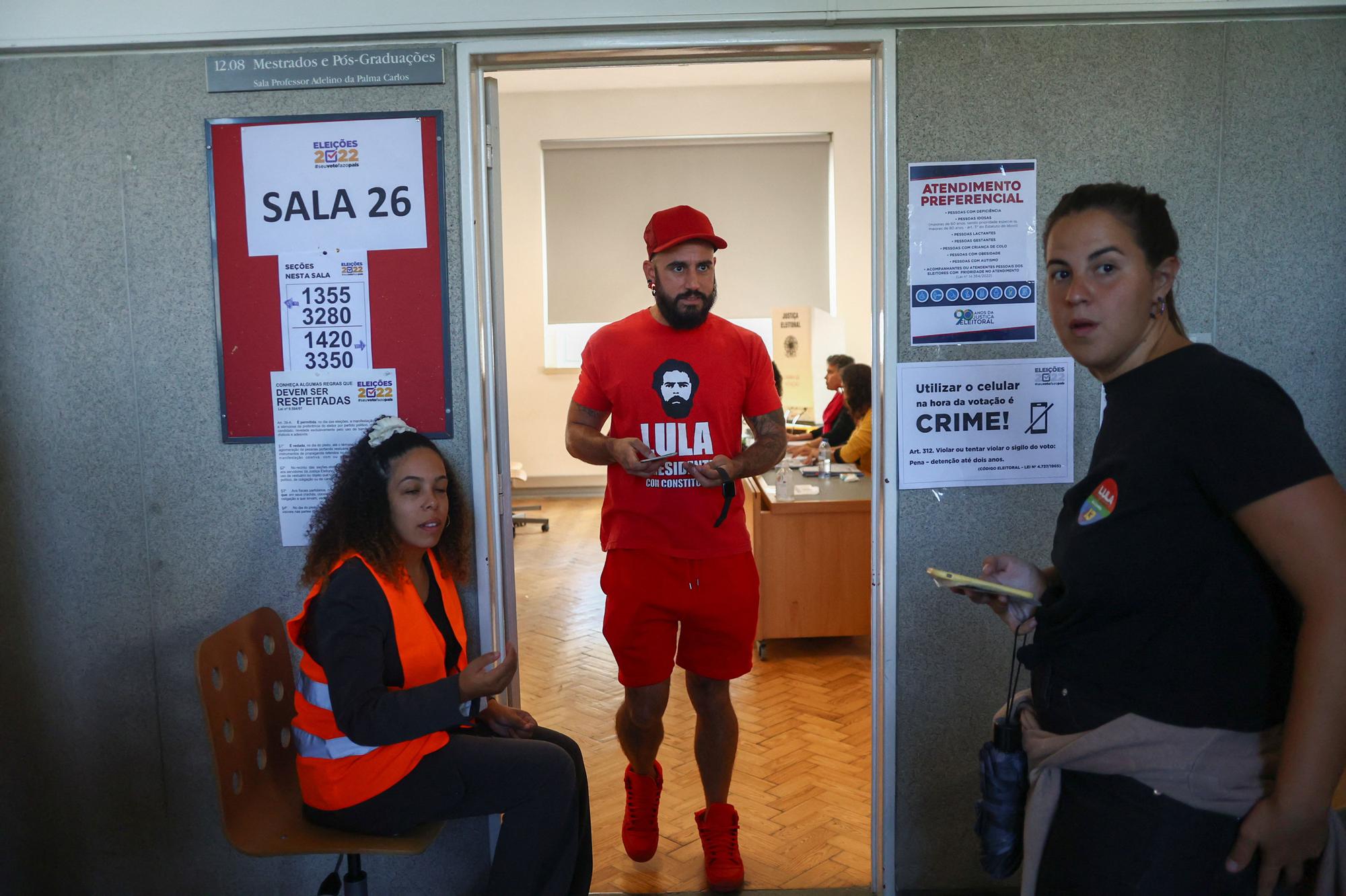 A citizen of Brazil leaves a voting station after casting his vote for his country's election, in Lisbon