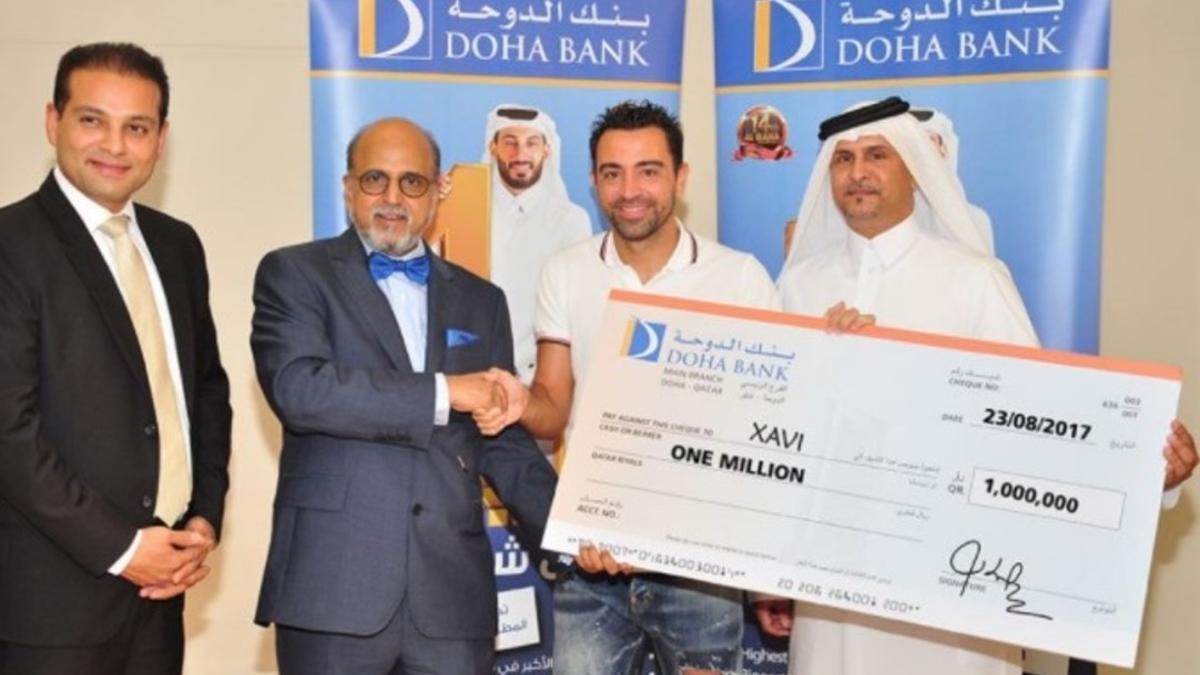 Xavi y los directivos del doha bank