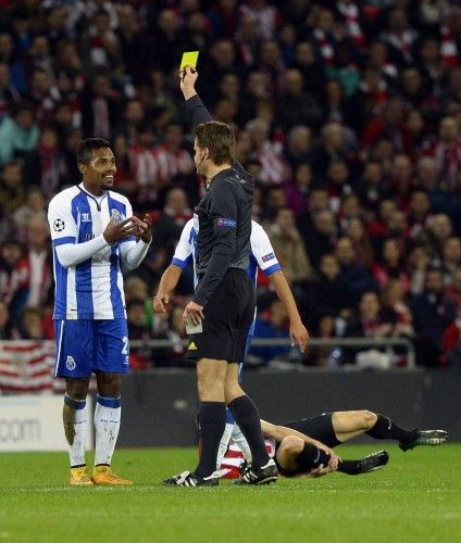 Porto's Sandro receives a yellow card during their Champions League Group H soccer match against Athletic Bilbao at San Mames stadium in Bilbao