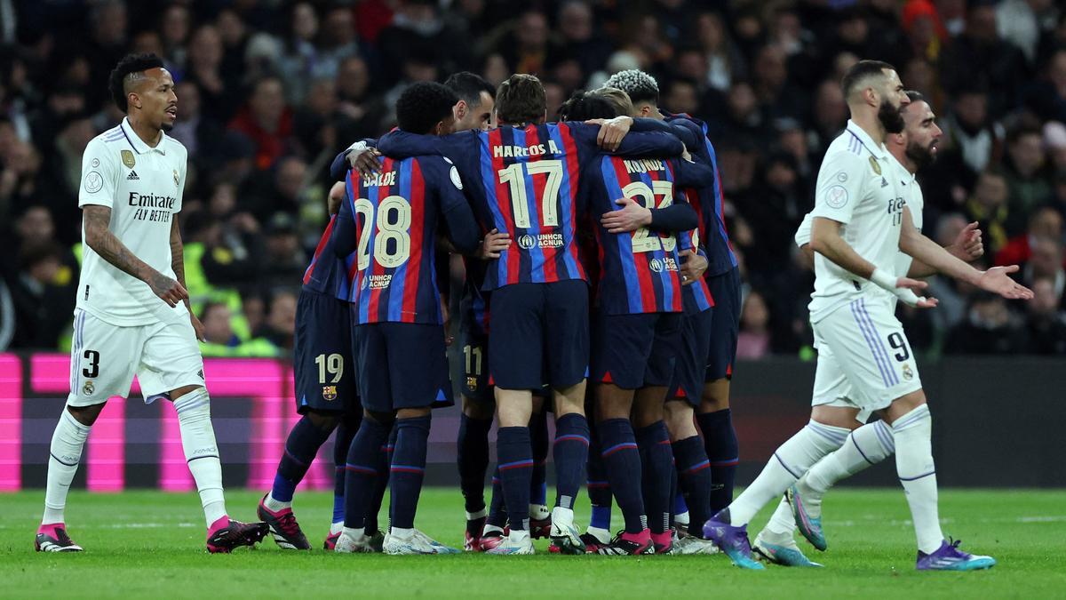 Barcelona's players celebrate the opening goal scored by Barcelona's Ivorian midfielder Franck Kessie during the Copa del Rey (King's Cup) semi final first leg football match between Real Madrid CF and FC Barcelona at the Santiago Bernabeu stadium in Madrid on March 2, 2023. (Photo by Pierre-Philippe Marcou / AFP)