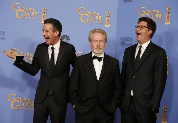 Ridley Scott, Simon Kinberg and Michael Scheafer pose with their award during the 73rd Golden Globe Awards in Beverly Hills