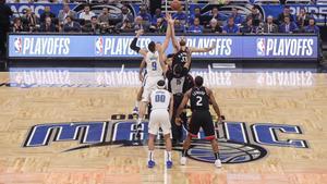 ORLANDO, FL - APRIL 21: Nikola Vucevic #9 of the Orlando Magic goes up against Marc Gasol #33 of the Toronto Raptors on the opening tip off at the start of Game Four of the first round of the 2019 NBA Eastern Conference Playoffs at the Amway Center on April 21, 2019 in Orlando, Florida. The Raptors defeated the Magic 107-85. NOTE TO USER: User expressly acknowledges and agrees that, by downloading and or using this photograph, User is consenting to the terms and conditions of the Getty Images License Agreement.   Don Juan Moore/Getty Images/AFP
