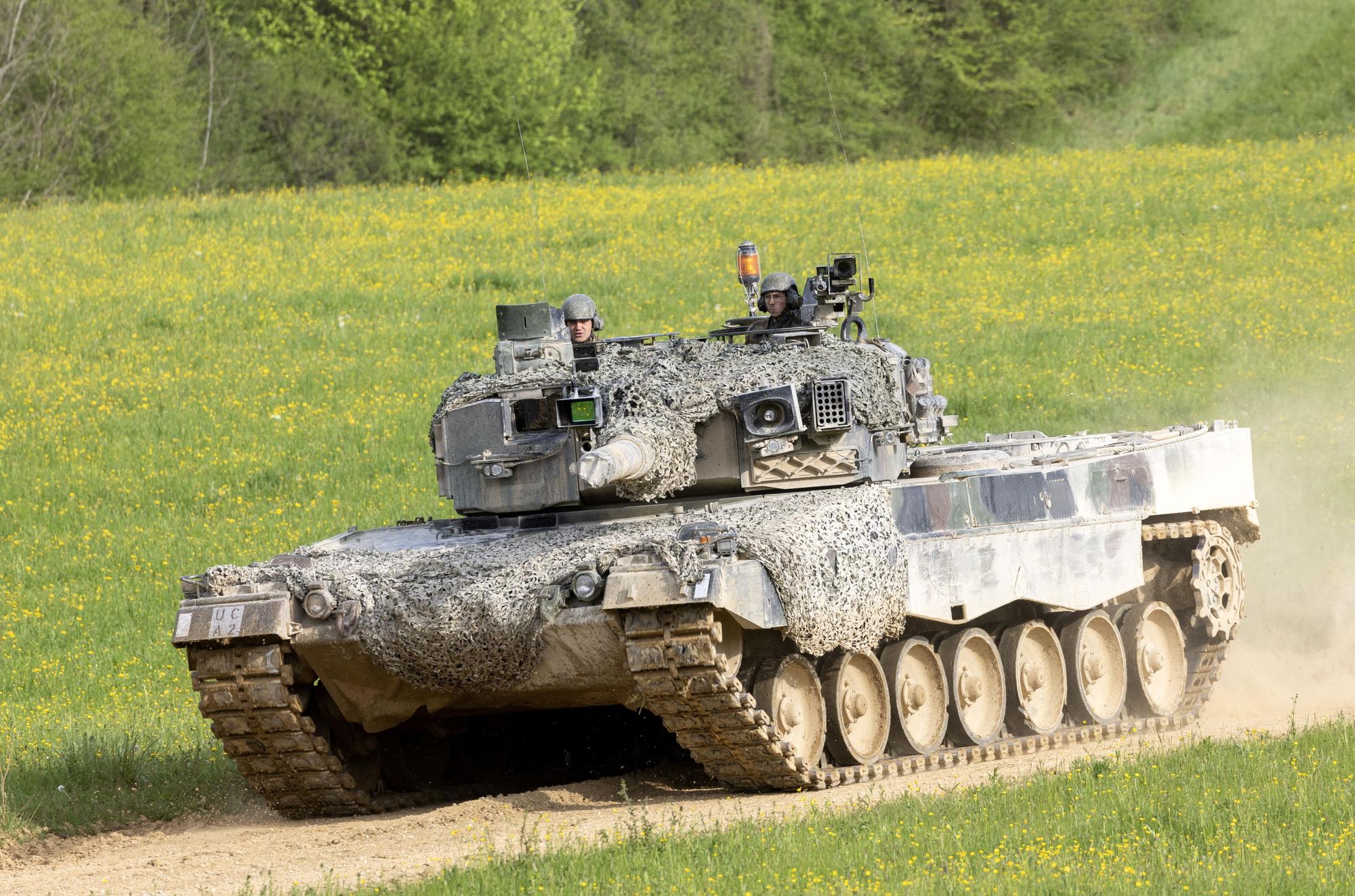 Recruits of the Swiss army Tank School 21 perform an attack exercise with the Leopard 2 tank in Bure