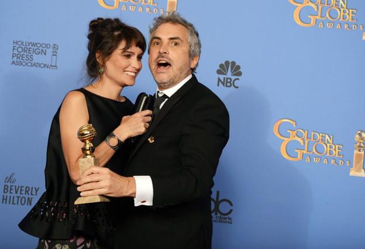 Alfonso Cuaron, millor director per ’Gravity’, amb Sheherazade Goldsmith.