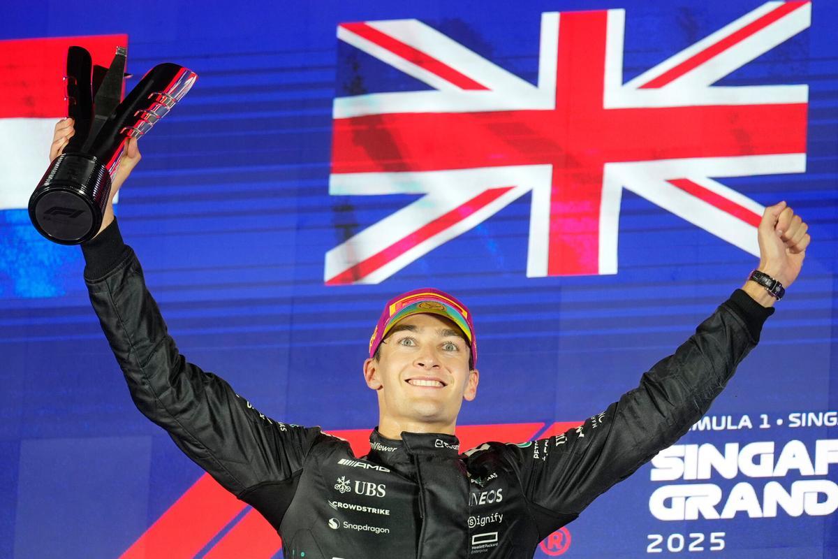 Mercedes driver George Russell of Britain celebrates after winning the Singapore Formula One Grand Prix at the Marina Bay Street Circuit in Singapore, Sunday, Oct. 5, 2025. (AP Photo/Vincent Thian)