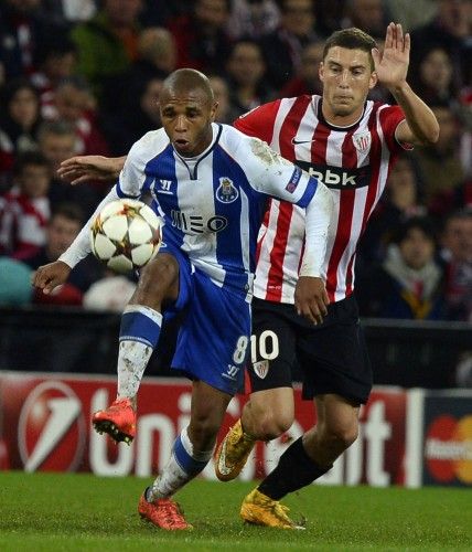 Athletic Bilbao's Oscar de Marcos fights for the ball with Porto's Yacine Brahimi during their Champions League Group H soccer match at San Mames stadium in Bilbao