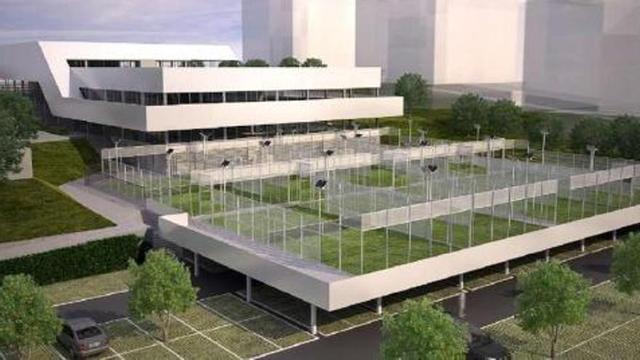 Recreación del edificio con las canchas de paddle en primer término, al mismo nivel que las tres piscinas, en el interior.
