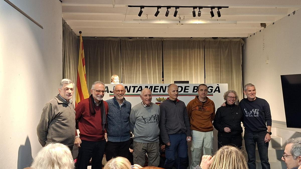 Els homenatjats, pels 25 anys de supost a la baixada de faies des del Siti