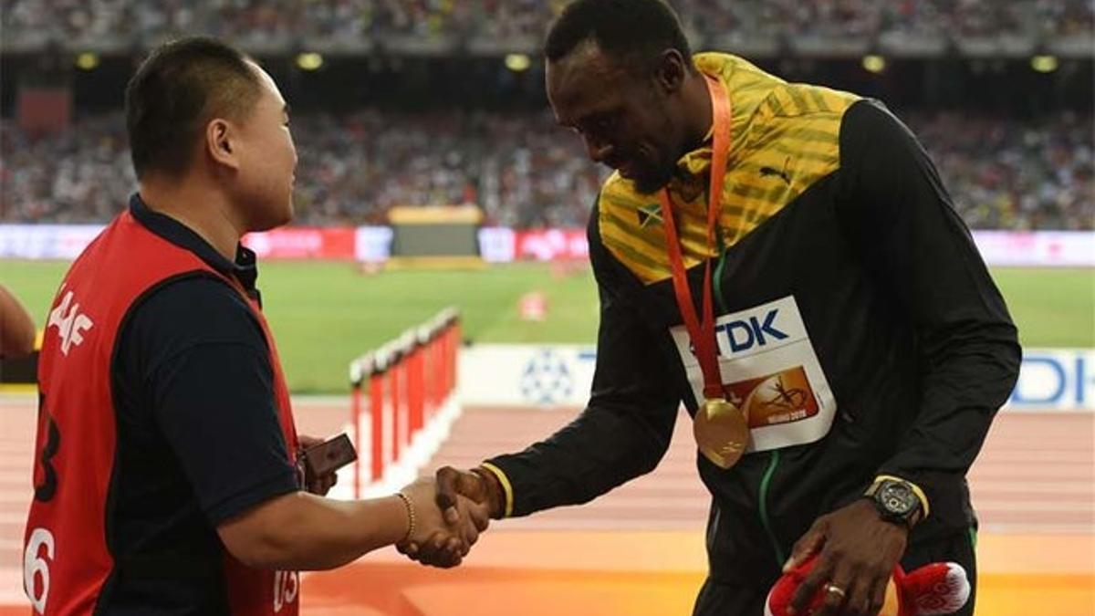 Bolt saludó al reportero en Beijing