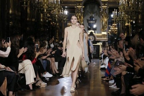 Models present creations by British designer Stella McCartney as part of her Spring/Summer 2015 women's ready-to-wear collection during Paris Fashion Week