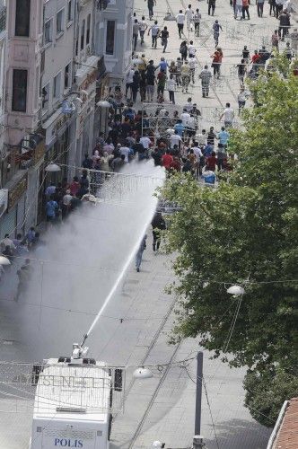 Riot police use water cannon to disperse anti-government protesters at Taksim square in central Istanbul