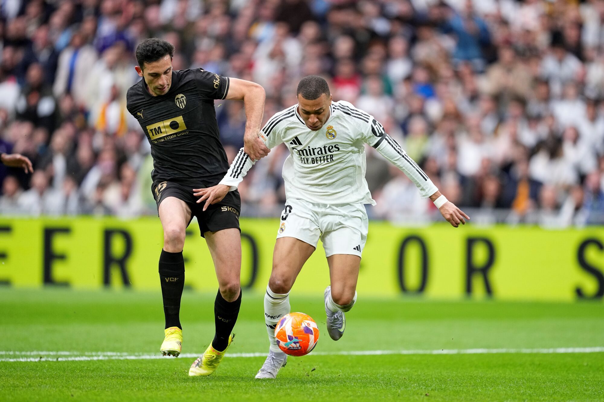 Kylian Mbappe of Real Madrid receives a penalty from Cesar Tarrega of Valencia during the Spanish League, LaLiga EA Sports, football match played between Real Madrid and Valencia CF at Santiago Bernabeu stadium on April 05, 2025, in Madrid, Spain. AFP7 05/04/2025 ONLY FOR USE IN SPAIN. Oscar J. Barroso / AFP7 / Europa Press;2025;SOCCER;SPAIN;SPORT;ZSOCCER;ZSPORT;Real Madrid v Valencia CF - LaLiga EA Sports;