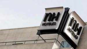 FILE PHOTO: The logo of Spanish NH Hoteles chain is seen on the roof of one of its hotel in central Madrid October 28, 2009.  REUTERS/Sergio Perez/File Photo