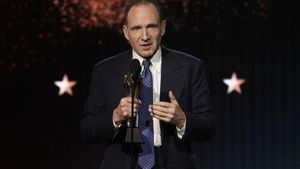 Ralph Fiennes accepts the award for best acting ensemble for Conclave during the 30th Critics Choice Awards on Friday, Feb. 7, 2025, at the Barker Hangar in Santa Monica, Calif. (AP Photo/Chris Pizzello). EDITORIAL USE ONLY/ONLY ITALY AND SPAIN