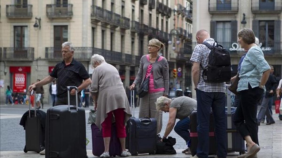 Turistas en la plaza de Sat Jaume.