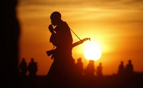 Rebel fighters walk in a rebel controlled territory in Upper Nile State