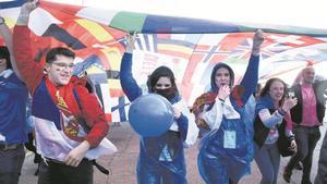 Thessaloniki, Greece - April 18, 2019. Erasmus students hold a giant multinational flag as they take part in a parade during an annual Erasmus student meeting.