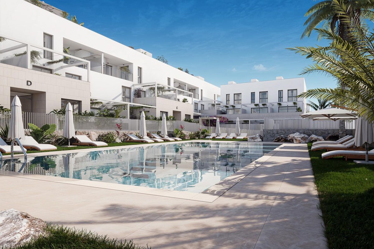 La promoción de viviendas de obra nueva de Windsor and Meyers cuenta con piscina comunitaria.
