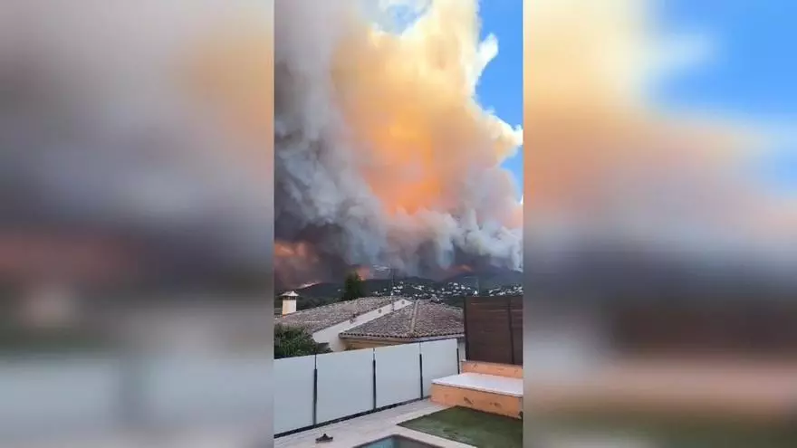 Los vecinos confinados siguen desde sus viviendas la evolución del fuego