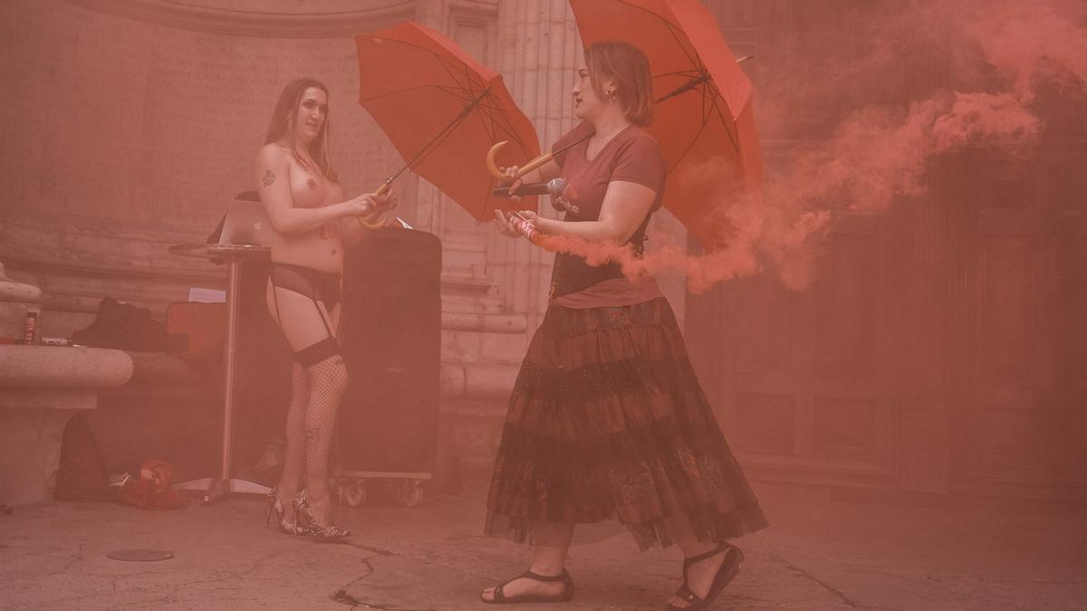 EDITORS NOTE: Graphic content / Prostitutes take part in a happening action to mark the international day of the sex workers and to protest against the 2016 French law on prostitution, in front of the Saint-Nizier church, emblematic of their fight on June 2, 2021, in Lyon. (Photo by JEAN-PHILIPPE KSIAZEK / AFP)