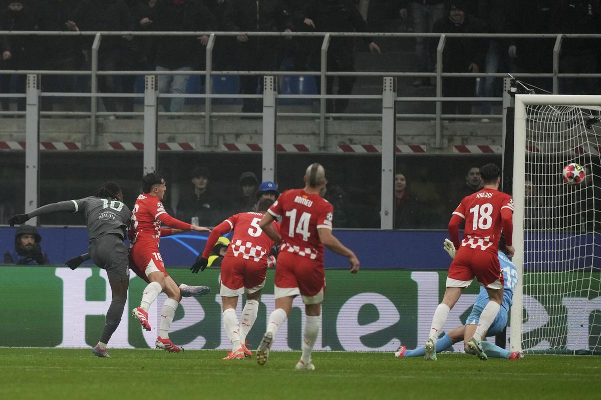AC Milans Rafael Leao, left, scores the opening goal during the Champions League opening phase soccer match between AC Milan and Girona at the San Siro stadium in Milan, Italy, Wednesday, Jan. 22, 2025. (AP Photo/Antonio Calanni). EDITORIAL USE ONLY/ONLY ITALY AND SPAIN AC Milans Rafael Leao, left, scores the opening goal during the Champions League opening phase soccer match between AC Milan and Girona at the San Siro stadium in Milan, Italy, Wednesday, Jan. 22, 2025. (AP Photo/Antonio Calanni). EDITORIAL USE ONLY/ONLY ITALY AND SPAIN