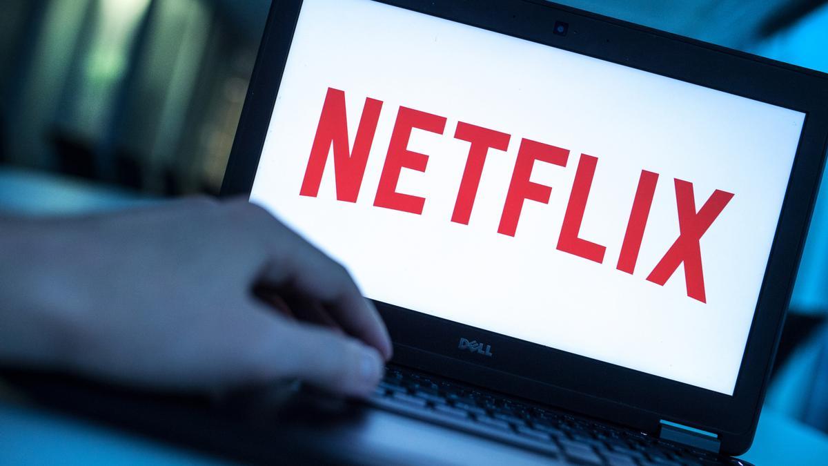 The logo of the video streaming service Netflix is seen on the display of a laptop.