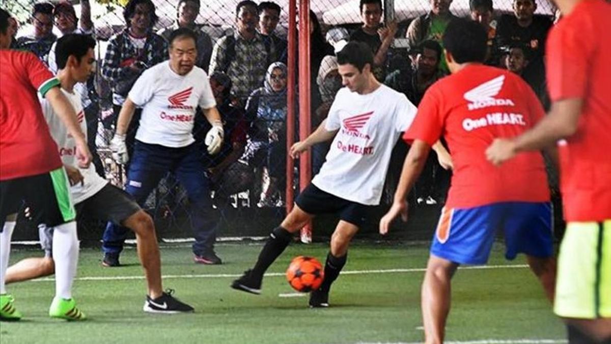 Pedrosa y Nakamoto, durante el partido